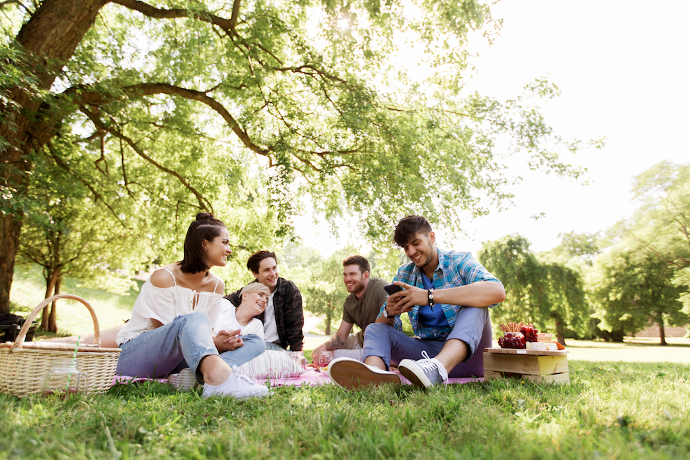 Group of people together for spring or summer picnic outdoor party | Fun Services Midwest