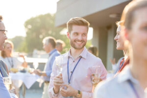 Young man socializing with glass of champagne | Fun Services Midwest