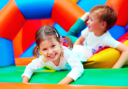 Child on inflatable | Fun Services Midwest