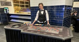 casino dealer at table | FSMW